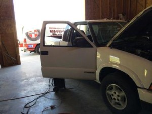 Working on a Chevy S10 inside a customers garage.